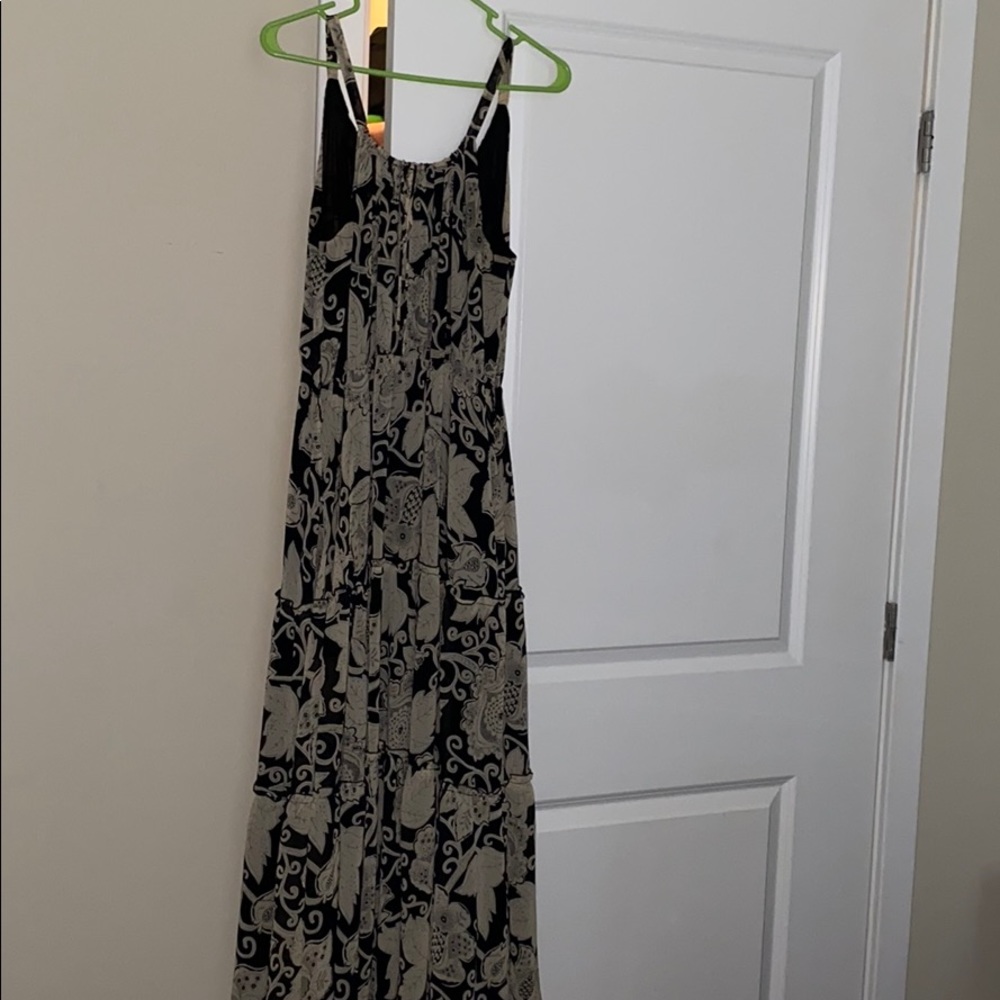 Beautiful Polyester long flowing sleeveless dress.